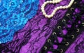 Lingerie and Pearls Background Purple and Black Lace Lingerie and Pearls Background Purple and Black Lace With Blue Lace Royalty Free Stock Photo