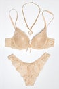 Lingerie set with necklace golden beige color Royalty Free Stock Photo