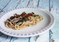 Linguine pasta with anchovies, black cabbage and dried tomatoes Royalty Free Stock Photo