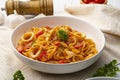 Linguine pasta with squid and cherry tomato in tomato sauce