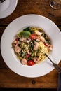 Linguine with shrimp, cherry tomatoes and capers