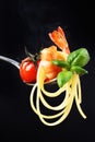 Linguini served with grilled cherry tomato, shrimp and basil Royalty Free Stock Photo