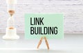 LINK BUILDING text written on a notebook with pen on chart Royalty Free Stock Photo