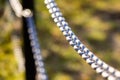 Linked chains shot at a wide aperture. Royalty Free Stock Photo