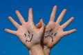 Linked hands with smiles and sadness pattern Royalty Free Stock Photo