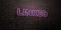 LINKED -Realistic Neon Sign on Brick Wall background - 3D rendered royalty free stock image