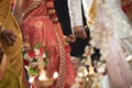 Linking pinky fingers at a Ceylonese Hindu wedding