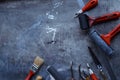 Linocut background. Group of linocutting tools on dark table Royalty Free Stock Photo