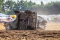 People on a Stockcar on a dirty track at a Stockcar challenge. Royalty Free Stock Photo