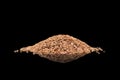 Linseeds. Flax seeds isolated on black background. Flax seed heap isolated on black background. Linseed pile closeup isolated on