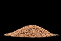 Linseeds. Flax seeds isolated on black background. Flax seed heap isolated on black background. Linseed pile closeup isolated on