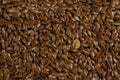 Brown Flax seed. Also known as Linseed, Flaxseed and Common Flax. Closeup of grains, background use