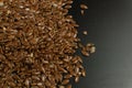 Brown Flax seed. Also known as Linseed, Flaxseed and Common Flax. Closeup of grains, background use