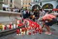 flowers and burning candles lie at a memorial in memory of upper austrian doctor Lisa-Maria Kellermayr