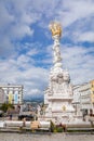 Linz, Austria, 27 August 2021: Baroque Holy Trinity column on Hauptplatz or main square in old town center at sunny summer day, Royalty Free Stock Photo