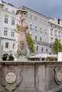 Linz, Austria, 27 August 2021: Baroque Neptunbrunnen fountain with sculptures of dolphins, Hauptplatz or main square at sunny