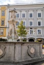 Linz, Austria, 27 August 2021: Baroque Neptunbrunnen fountain with sculptures of dolphins, Hauptplatz or main square at sunny