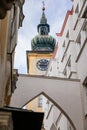 Linz, Austria, 27 August 2021: Medieval catholic Baroque Stadtpfarrkirche, clock bell tower, Parish Church at Pfarrplats, old town Royalty Free Stock Photo