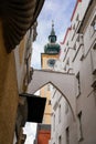 Linz, Austria, 27 August 2021: Medieval catholic Baroque Stadtpfarrkirche, clock bell tower, Parish Church at Pfarrplats, old town Royalty Free Stock Photo