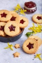 Linzer Christmas cookies with stars. Delicious biscuits with raspberry jam.