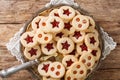 Linzer cookies with jam on a plate. Traditional Austrian biscuits filled. Horizontal top view Royalty Free Stock Photo