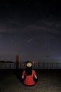 Lio beach, El Nido, Palawan - July 23, 2020: Woman looking at the comet neowise.