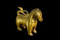 Lion ancient statue - Golden lion statue in Thai style with isolated on black background. Royalty Free Stock Photo