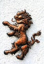 Lion bronze figure on the white wall