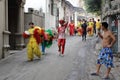 Lion dance team walking in the alley