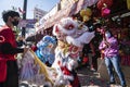 Lion dancers perform in front of a storefront in Los Angeles Chinatown