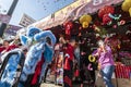 Lion dancers perform in front of a storefront in Los Angeles Chinatown