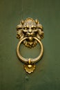 Lion Doorknocker on a Green Door