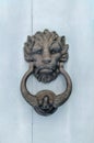 Lion head door knocker with the ring on its mouth on the entrance of a house, Malta. Italian traditional doorknob. Royalty Free Stock Photo