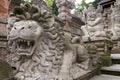 Lion head stone statue at Pura Dalem temple in Ubud