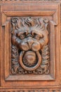 Lion head wood carving on wooden door Royalty Free Stock Photo