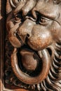 Lion head wood carving on wooden door Royalty Free Stock Photo