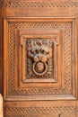 Lion head wood carving on wooden door Royalty Free Stock Photo