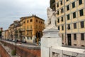 Lion holding a cartouche, stone carved sculpture at the embankment of Arno river, Pisa, Italy