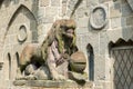 Lion with knight`s armor, stone sculpture, on entrance of Lions Castle, Kassel, Mountain  Park Wilhelmshoehe, Germany Royalty Free Stock Photo