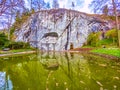 Lion of Lucerne monument in the rock with memorial pond in Lucerne, Switzerland Royalty Free Stock Photo