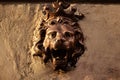 Lion metal head bas-relief on concrete wall Royalty Free Stock Photo