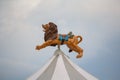 Lion over the dome of the carousel Royalty Free Stock Photo