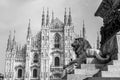 Lion sculpture against the cathedral at the Duomo Square, Piazza del Duomo in the center of Milan, Italy Royalty Free Stock Photo