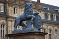 Lion sculpture with crest in front of the main entrance of the New Castle Neues Schloss in Germany, Stuttgart