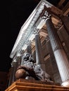 Lion sculpture in front of Pillars Building of Congress of Deputies Congreso de los Diputados in City.