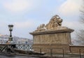 Lion sculptures of the Chain Bridge with the view of Budapest, H Royalty Free Stock Photo