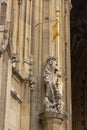 A lion stands guard before the royal entrance below the Victoria tower at the British Parliament building in London, England.