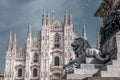 Lion statue against the cathedral at the Duomo Square, Piazza del Duomo in the center of Milan, Italy Royalty Free Stock Photo