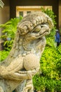 Lion statue in Chinese style in the Thai temple in the royal grand palace Royalty Free Stock Photo