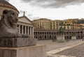 Lion statue closeup in front of cathedral at Plebiscito square, Naples. Italian architecture concept.